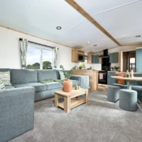 ABI_2024_lounge-grey furniture seating and a wooden coffee table